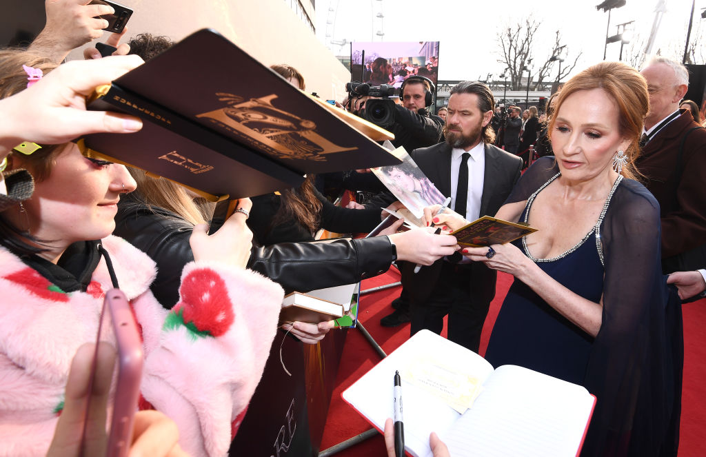 JK Rowling, signing books.