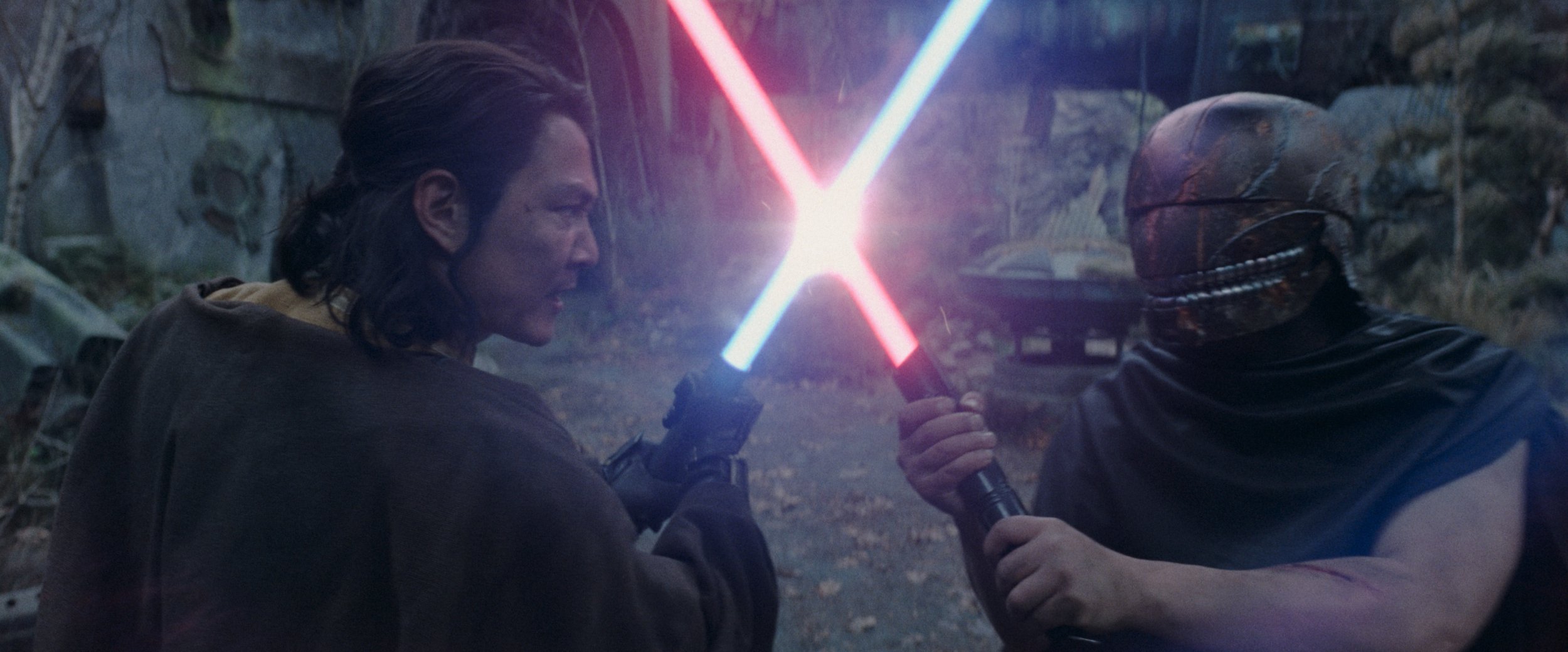 Lee Jung-jae and Manny Jacinto in The Acolyte engaged in a lightsaber fight